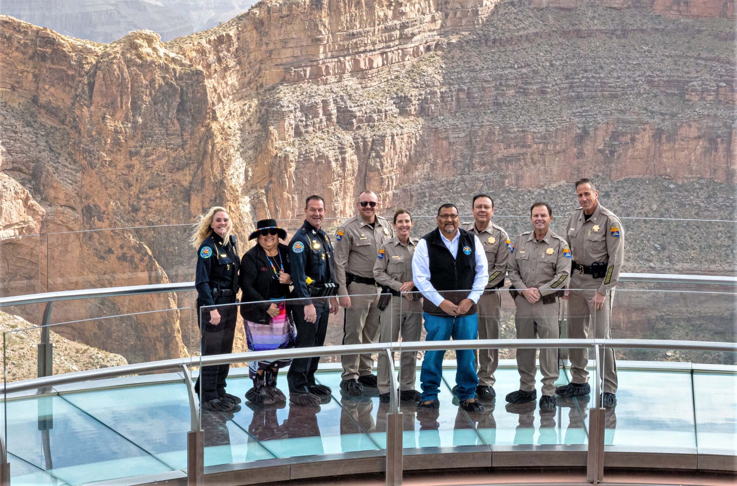 People pose on the Grand Canyon West Skywalk