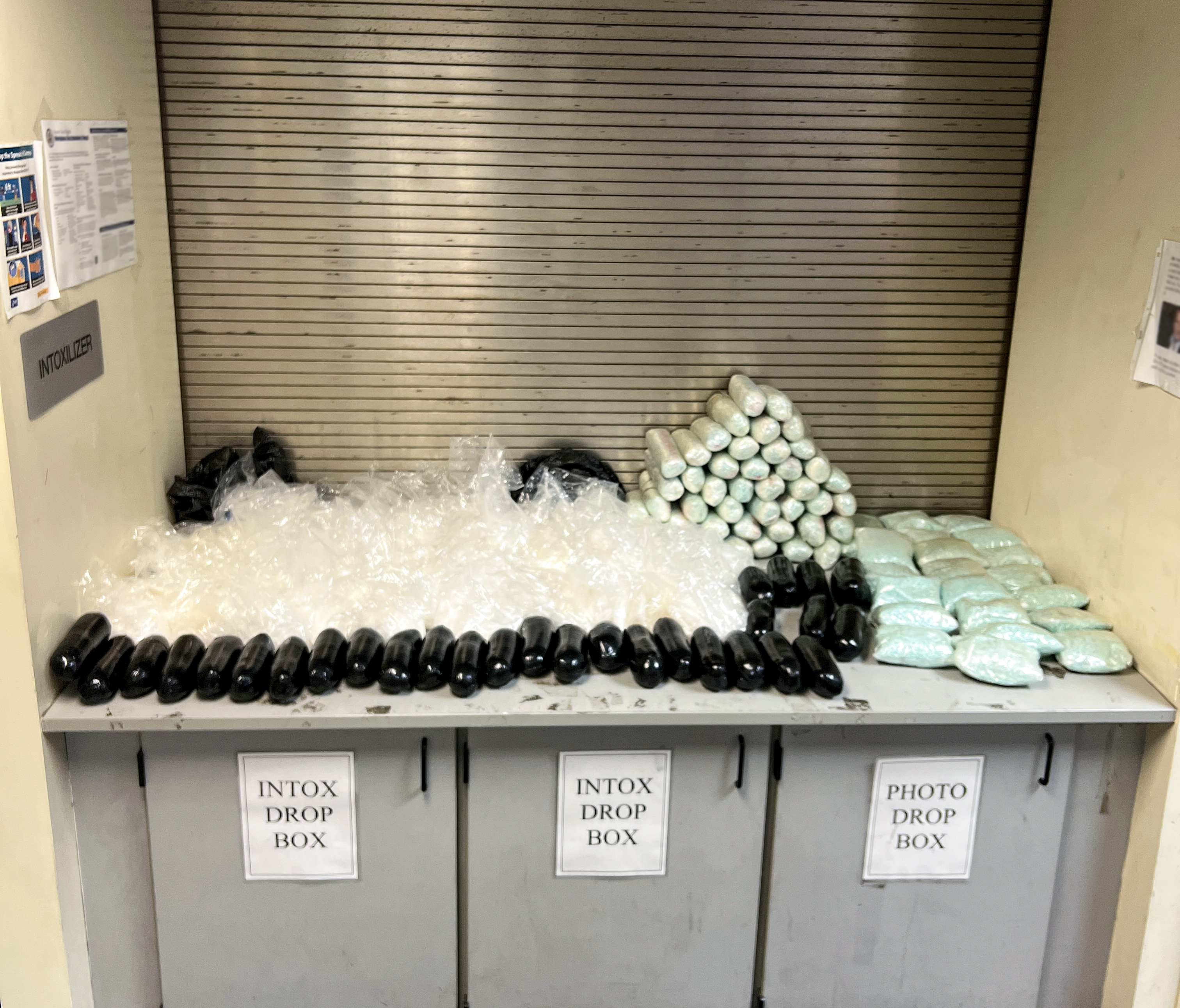 All of the seized drugs displayed on an evidence counter