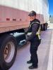 Inspector with a tractor-trailer at the point of entry