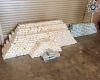 Piles of seized drugs wrapped in plastic packaging displayed on the ground 