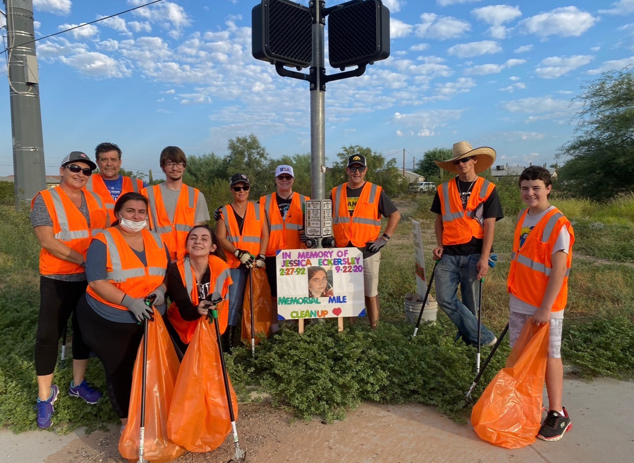 Jessica Eckersley's family and friends pose for a photo during a memorial clean up in her honor