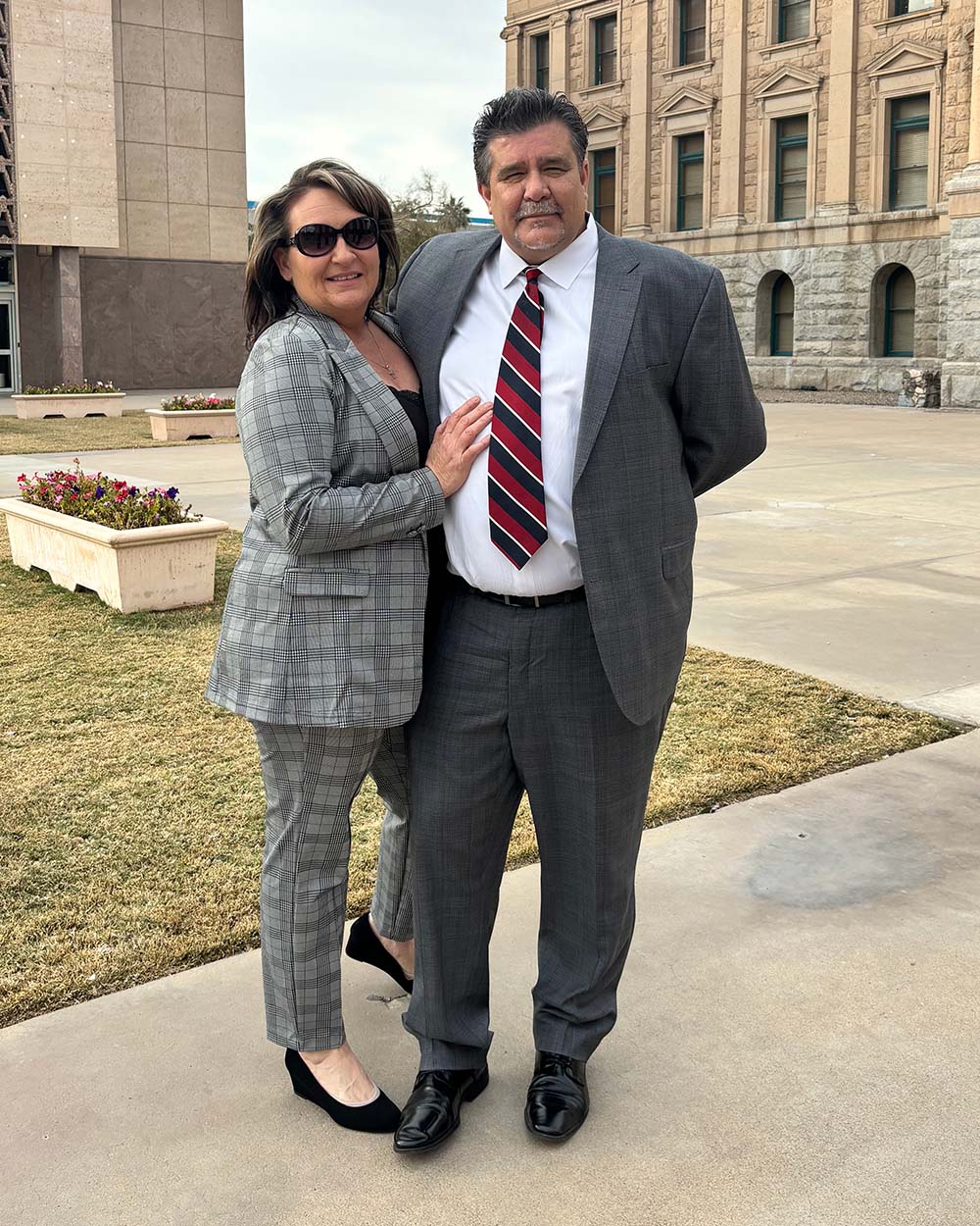 Jody Winters and her husband pose for a photo outside the Arizona State Capitol, where she spoke in support of Bentley's Law