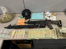 Firearms, cash and drugs seized