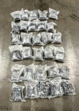 30 packages of fentanyl-laced pills displayed on the ground