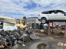 Property yard filled with vehicles and vehicle parts