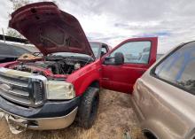 Stolen red pickup truck in property yard