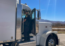 An ADOT Enforcement & Compliance Division officer speaks with a truck driver during an inspection as part of Operation Southern Shield.