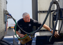 An AZDPS trooper conducts an inspection on a tractor-trailer near I-10 in Eloy during Operation Southern Shield.
