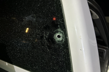 Photo of a bullet hole in the window of a vehicle