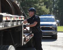 Trooper conducting a CMV inspection during International Roadcheck
