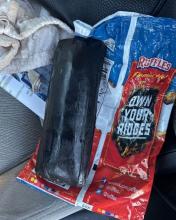 Photo of a black plastic-wrapped drug package