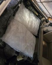 Packages of methamphetamine concealed in a car