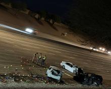 The crash scene on US 60 near Higley Road in Mesa, showing three vehicles with heavy damage