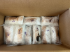 Bundles of methamphetamine and fentanyl piled on top of each other in a cardboard box