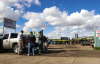 VTTF detectives stand outside an outside salvage yard with police tape