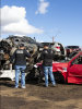 VTTF detectives look at cars and parts piled up in salvage yard