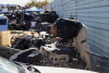 VTTF detectives look at cars and parts piled up in salvage yard