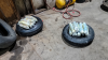 Bundles of pills wrapped in cellophane are pictured sitting on top of two tires on the floor