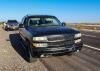 Chevrolet Tahoe stopped by police beside the highway