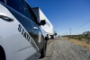 AZDPS SUV stopped behind a tractor-trailer beside a highway