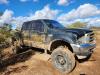 Dirt-covered pickup truck in the desert