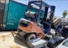 Orange Toyota forklift on a white trailer