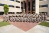 Thirty new Arizona State Troopers and class staff pose for a photo outside AZDPS headquarters