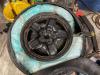 Bags of blue pills are seen inside a tire which has been cut in half