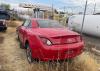 Stolen red sedan located in yard