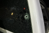 Photo of a bullet hole in the window of a vehicle