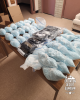 Drugs seized by troopers--including plastic bags filled with small blue pills and tightly wrapped bricks of powder-- are displayed on a table