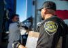 ADOT Enforcement and Compliance Division officer inspecting a CMV