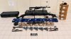 A photo of ten firearms, various gun parts, and ammunition seized by AZDPS troopers/detectives 