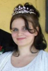 A photo of Jessica Eckersley smiling at the camera while wearing a tiara