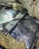 Plastic-wrapped packages of fentanyl powder concealed in a vehicle.